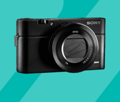 Wettbewerb: Sony Cyber-shot Kamera vor türkisfarbenem Hintergrund.